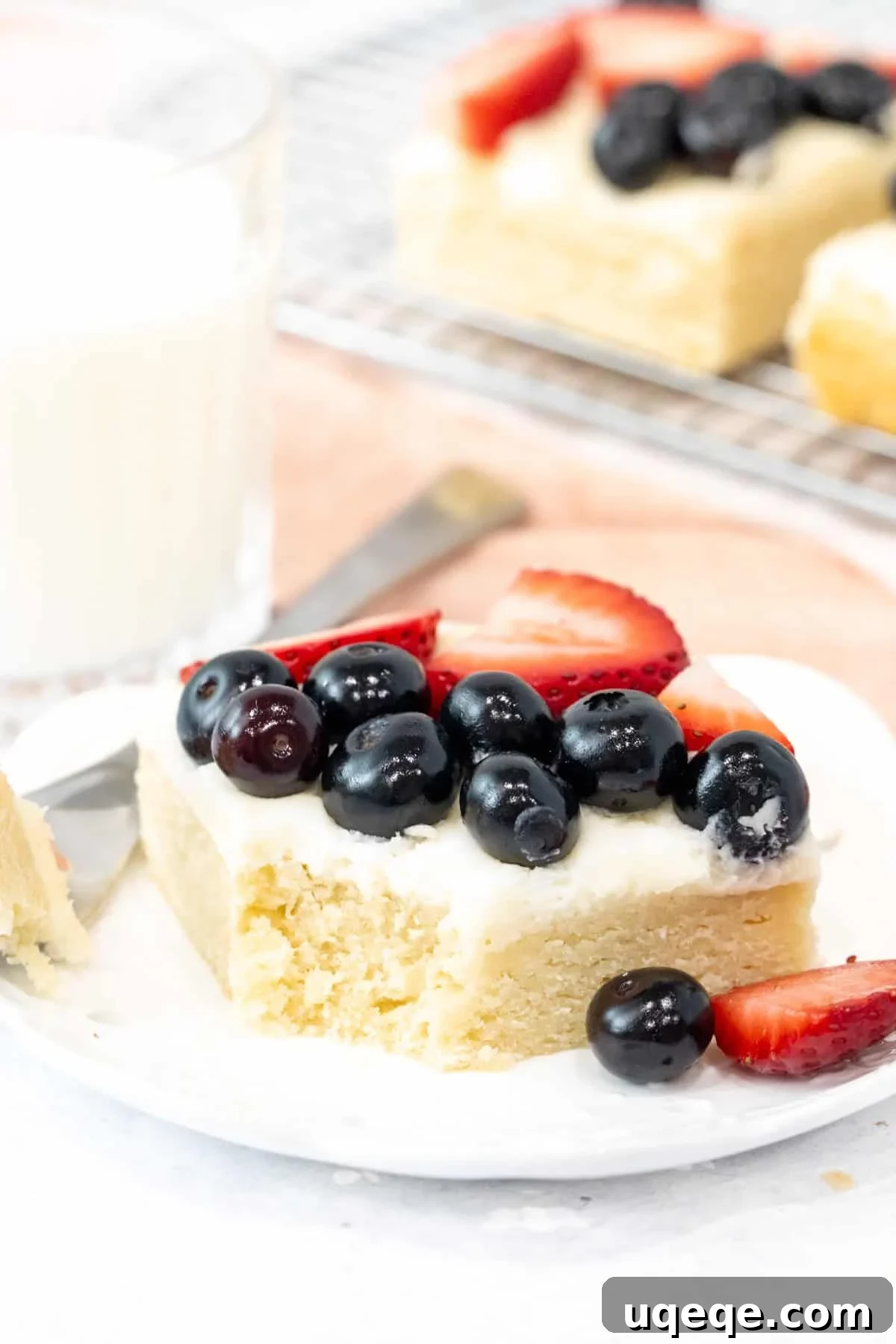 Sugar cookie bar with vanilla frosting and berries on top