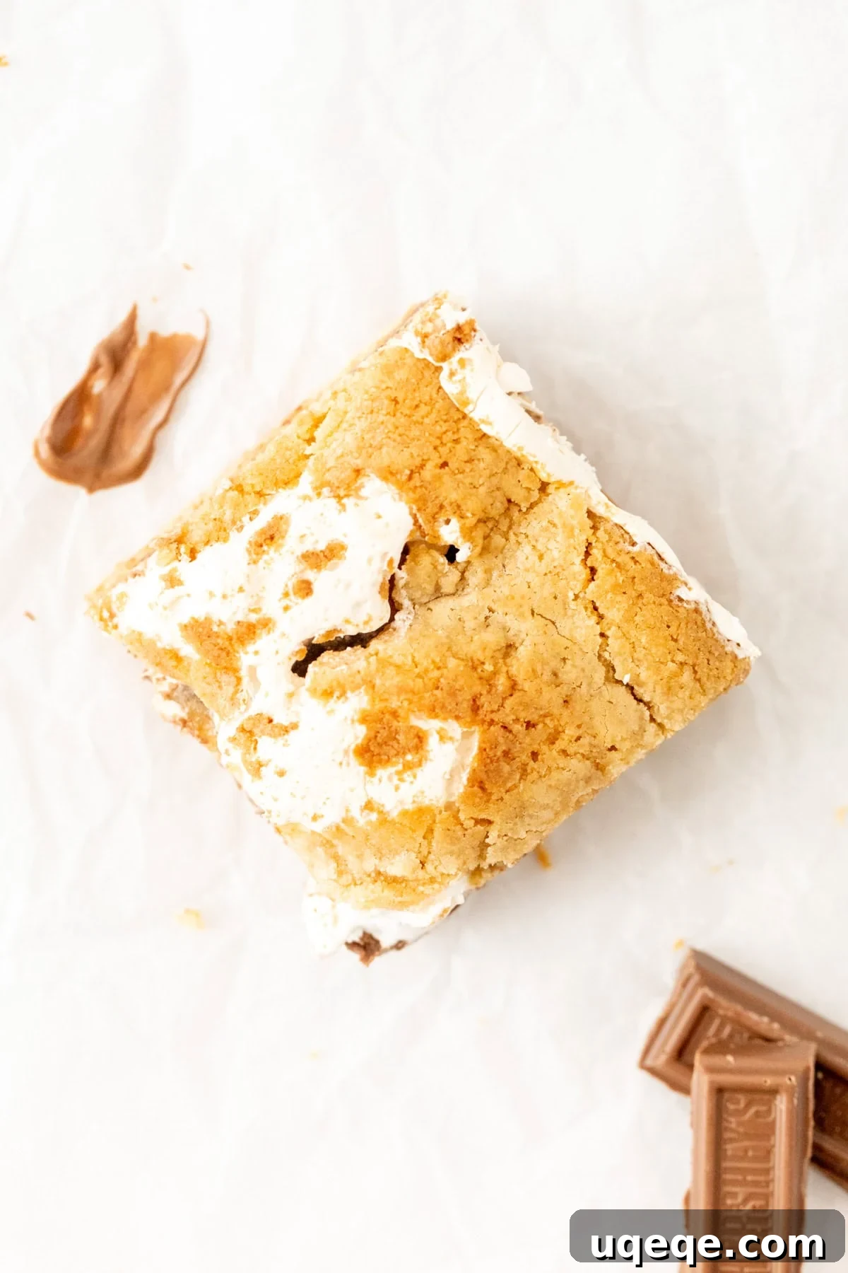 S'mores Cookie Bar Recipe: Gooey Graham, Chocolate & Marshmallow 3 S'mores blondie cut into a square, with marshmallow fluff
