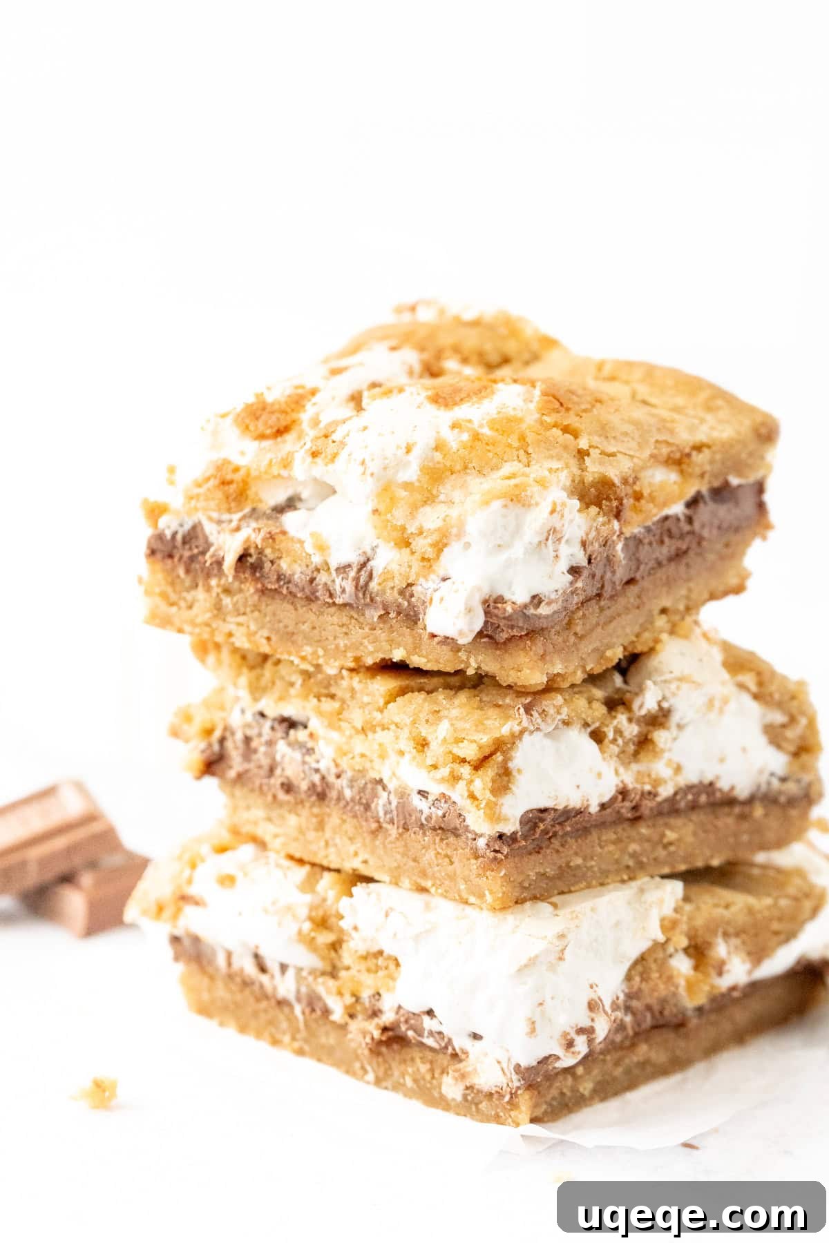 S'mores Cookie Bar Recipe: Gooey Graham, Chocolate & Marshmallow 6 Stack of three s'mores cookie bars with chocolate and marshmallow cream in the middle