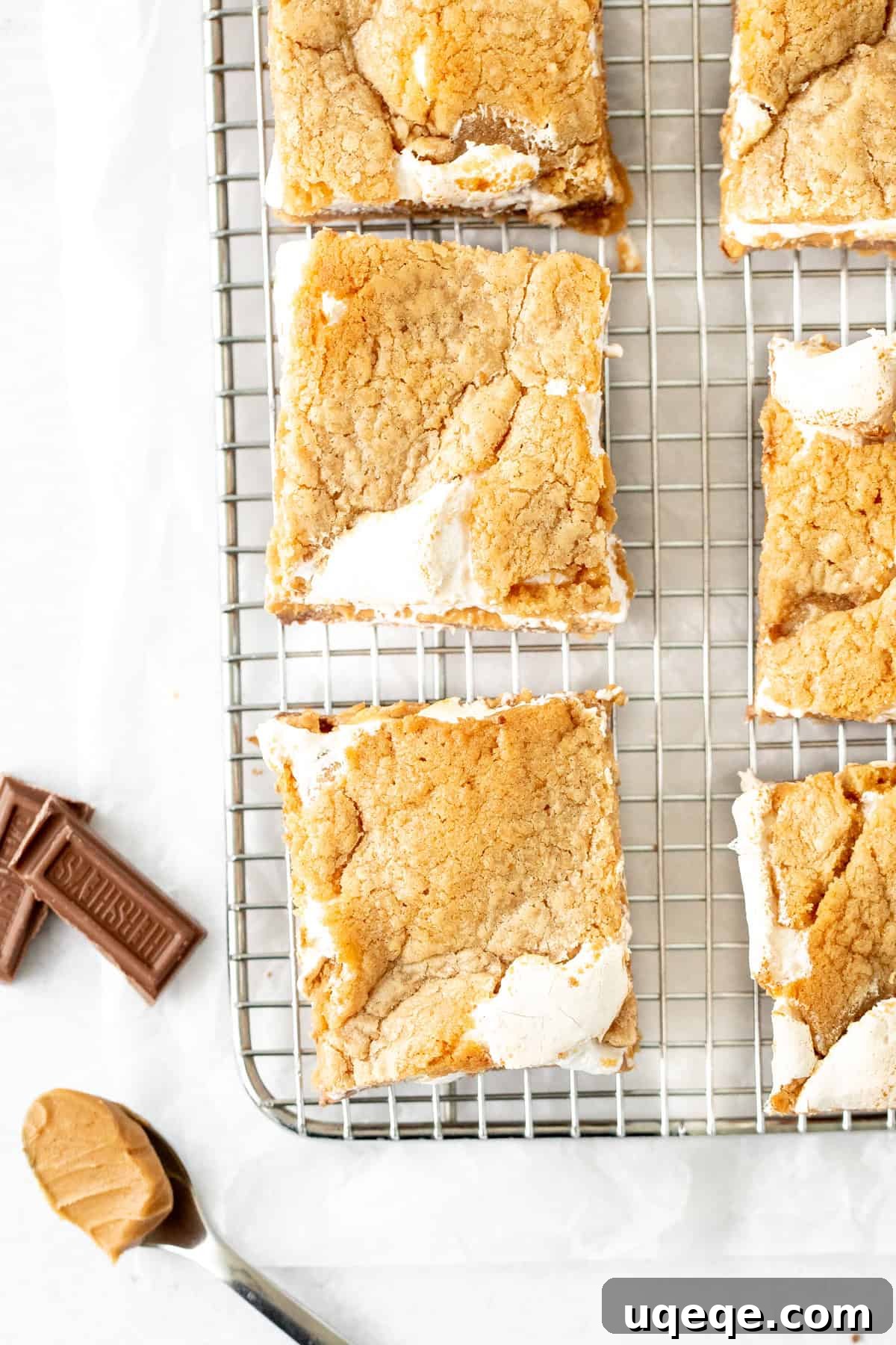 Peanut Butter S'mores Bars Recipe — Gooey Chocolate & Graham Cracker Bars 6 peanut butter cookie s'mores bars on a cooling rack