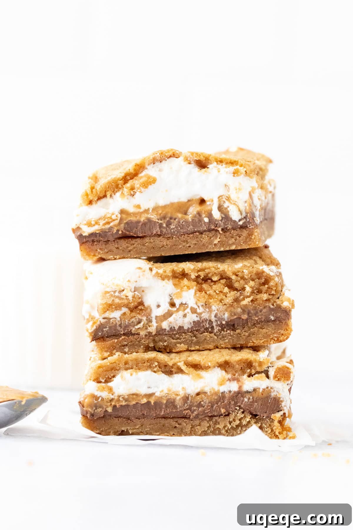 Peanut Butter S'mores Bars Recipe — Gooey Chocolate & Graham Cracker Bars 7 gooey peanut butter cookie s'mores bars, stacked one on top of another
