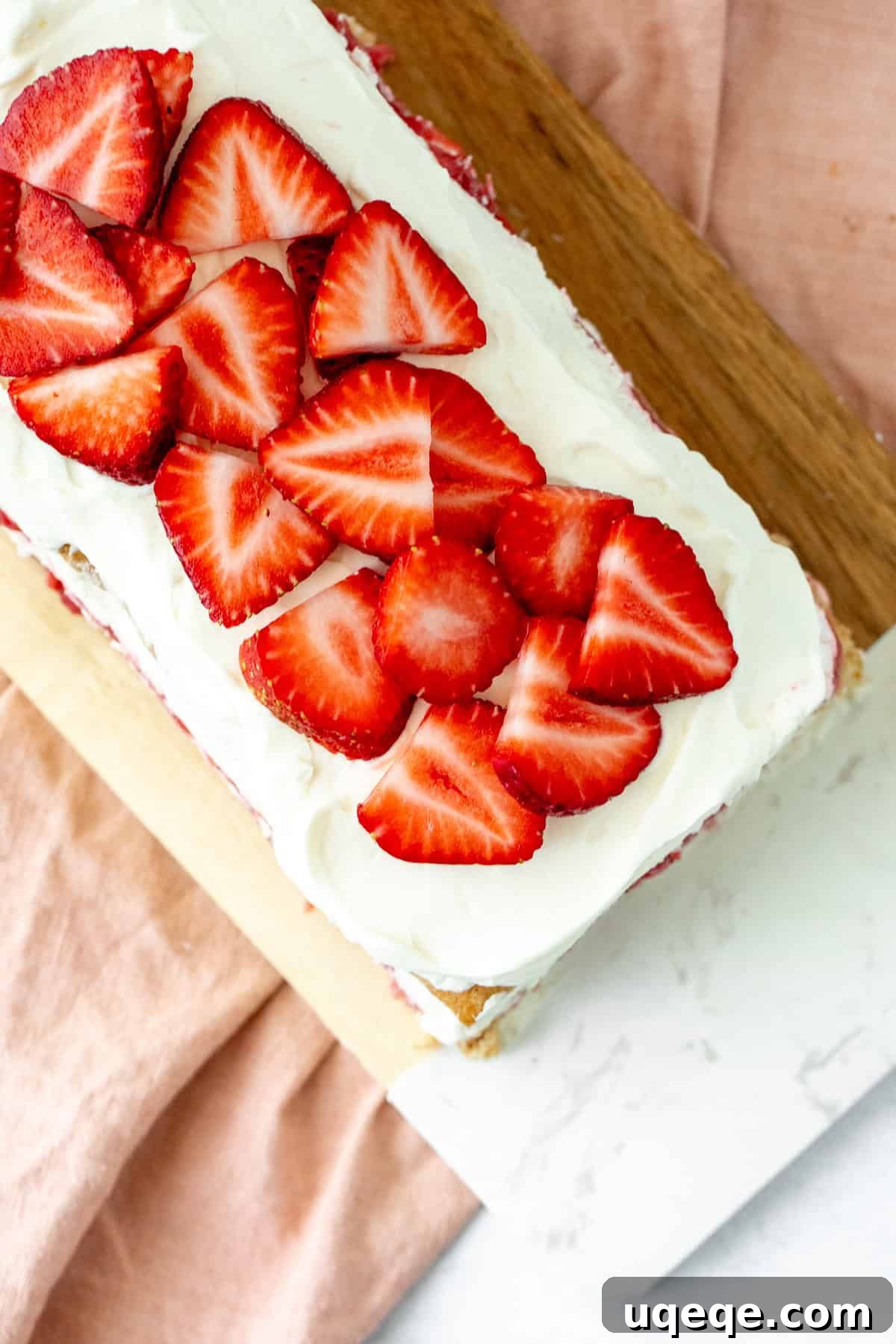 No-Bake Strawberry Icebox Cake Recipe with Whipped Cream 5 Strawberries and cream icebox cake topped with sliced berries