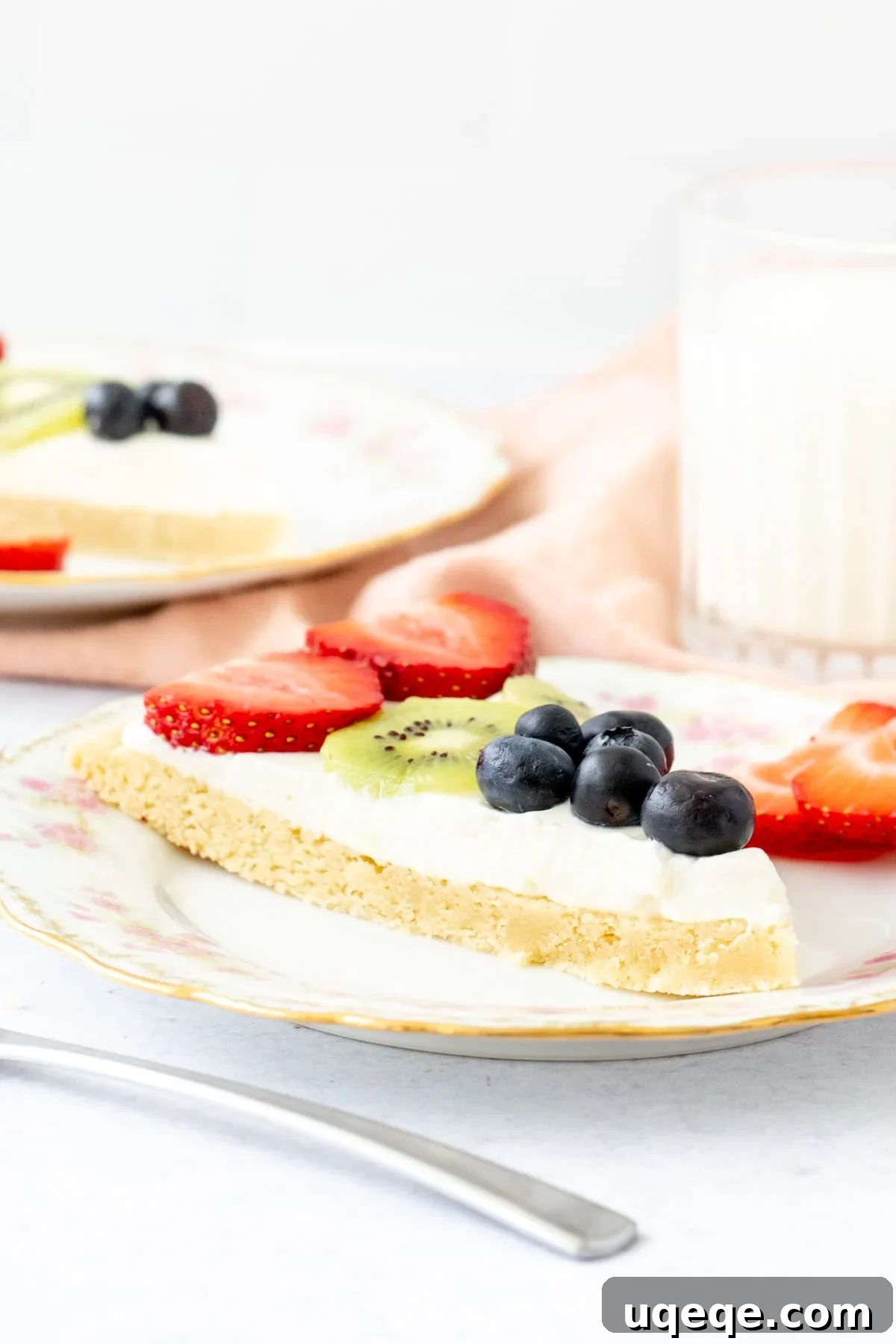 No-Bake Fruit Pizza with Cream Cheese Frosting 3 Slice of fruit pizza topped with whipped cream cheese frosting and fruit
