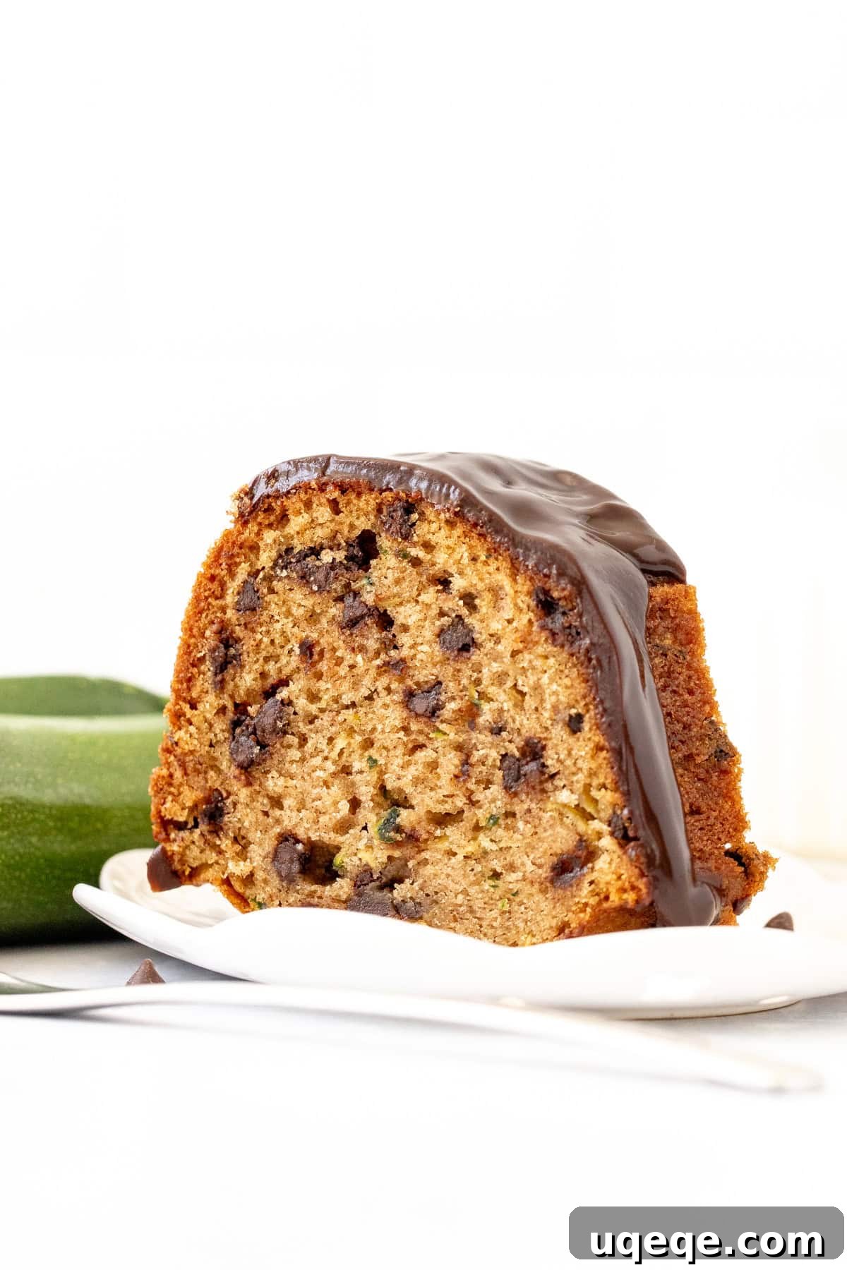 Moist Chocolate Chip Zucchini Cake Recipe 2 slice of chocolate chip zucchini cake with chocolate ganache on top