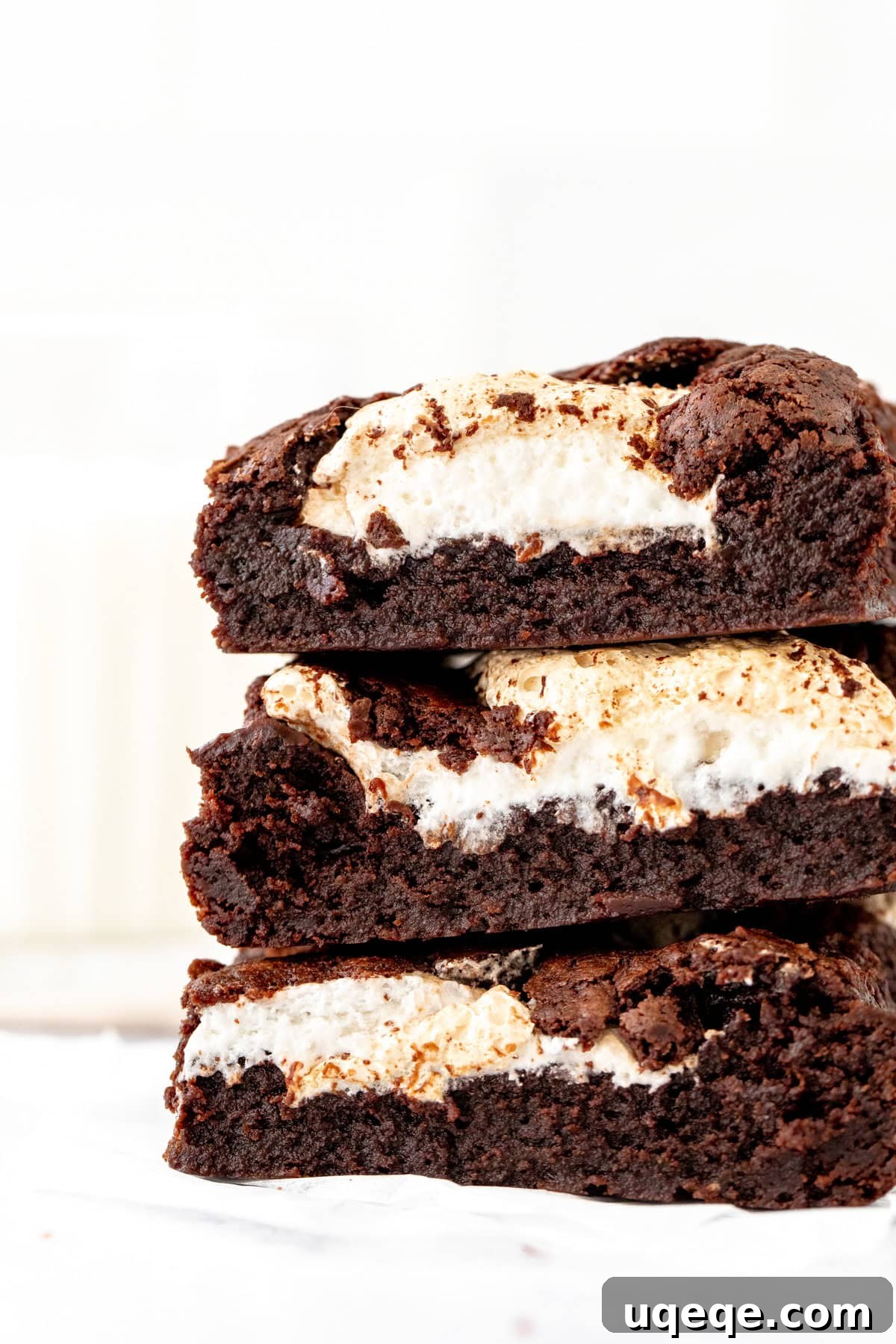 Gooey Marshmallow-Stuffed Chocolate Brownies 5 Stack of three brownies with dollops of marshmallow fluff