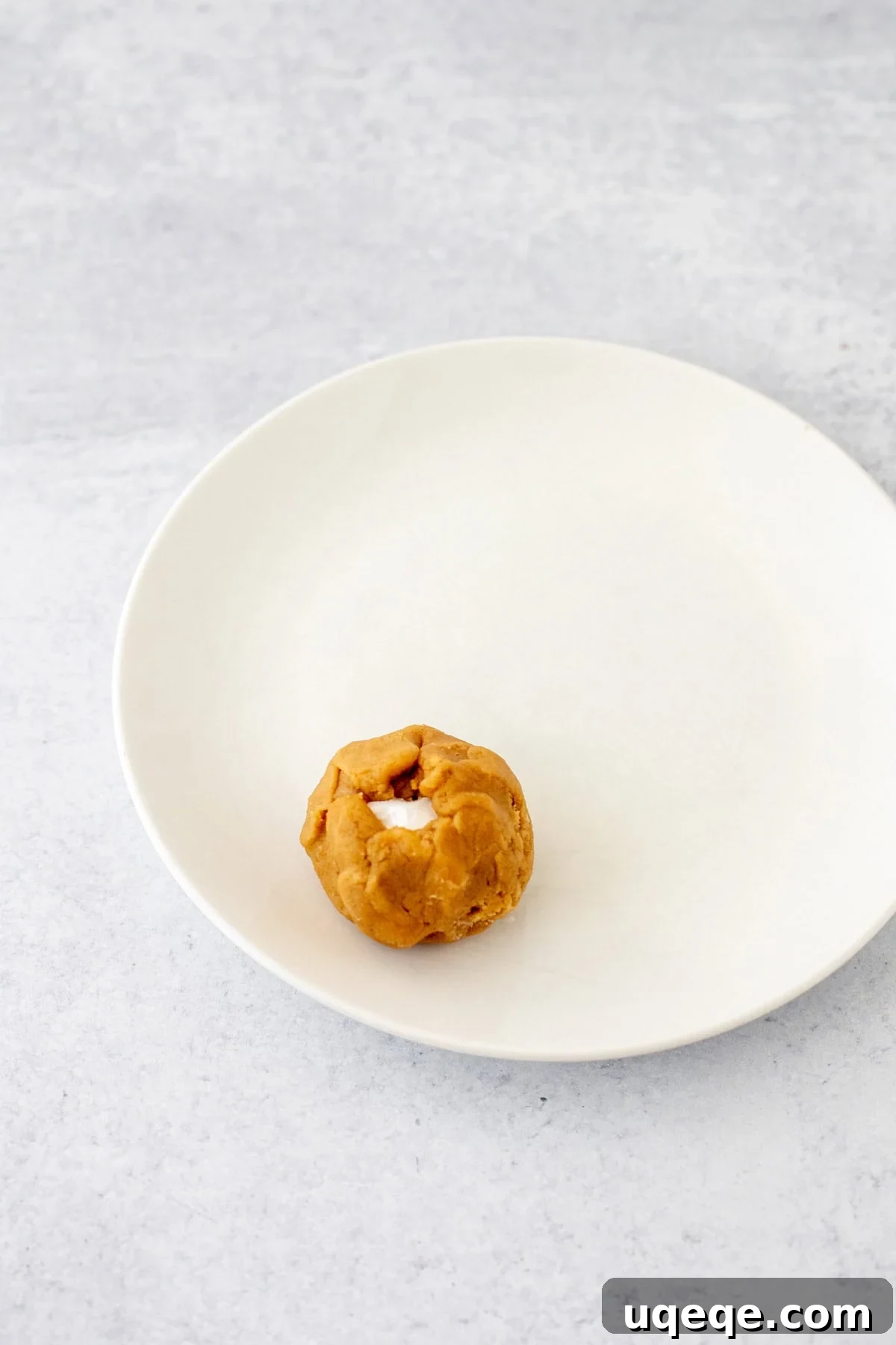 Fluffernutter Cookies: Peanut Butter & Marshmallow Cookies 4 Fluffernutter cookie dough ball on a plate